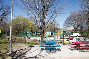 PHOTO BY GEREMY BORDONARO: Phase two of Christie Pits park’s revitalization continues as old playground equipment is removed from a fenced-in area. In the first phase, completed last fall, paths were replaced, lookouts were installed, and safety enhancements added.